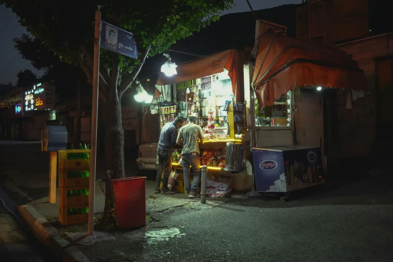 a man preparing to sell soing out of a cart