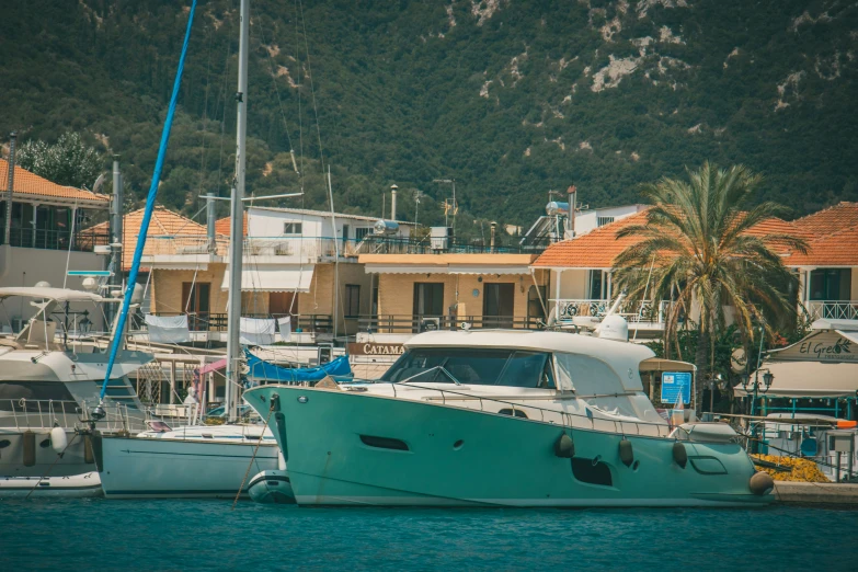 a boat sits docked next to the shore of a resort