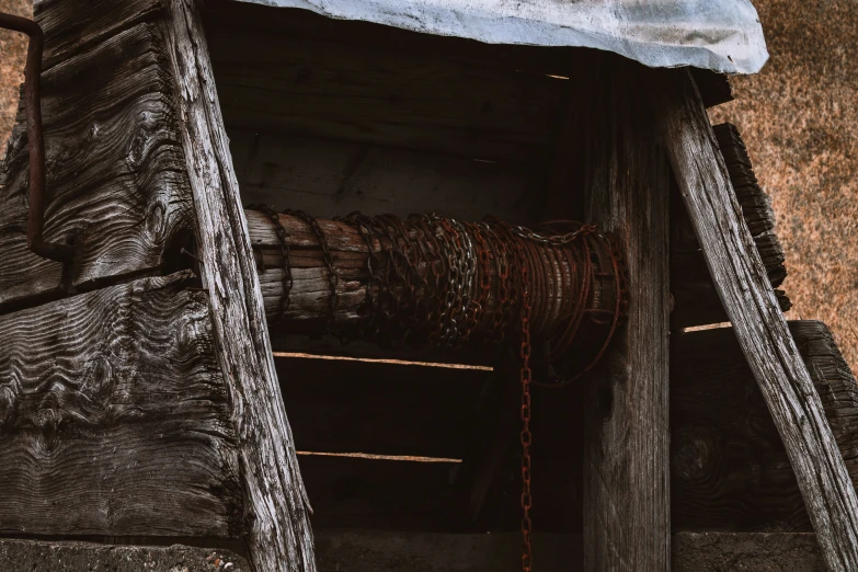 a stack of old rope inside a wooden cabin