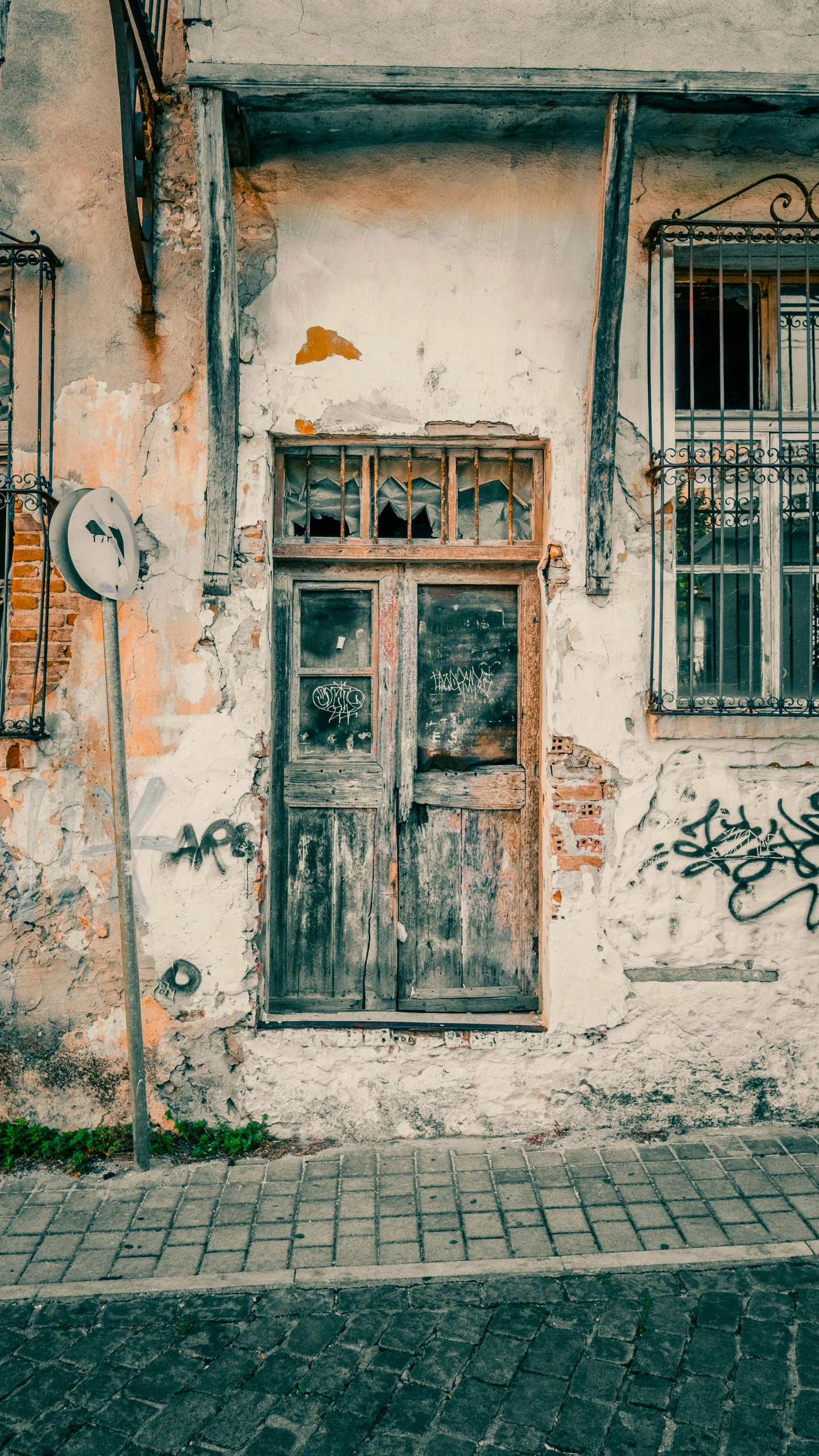 the old house is painted with graffiti