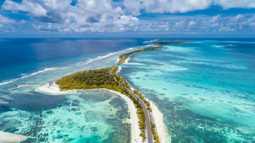 an island with some sand and water on it