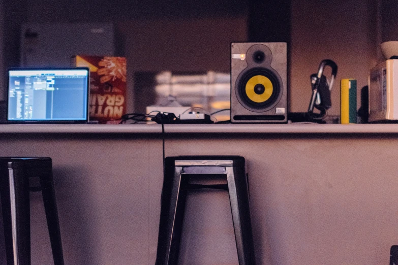 the home music system is on the shelf above a stool