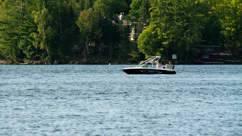 a boat is on the water near some trees