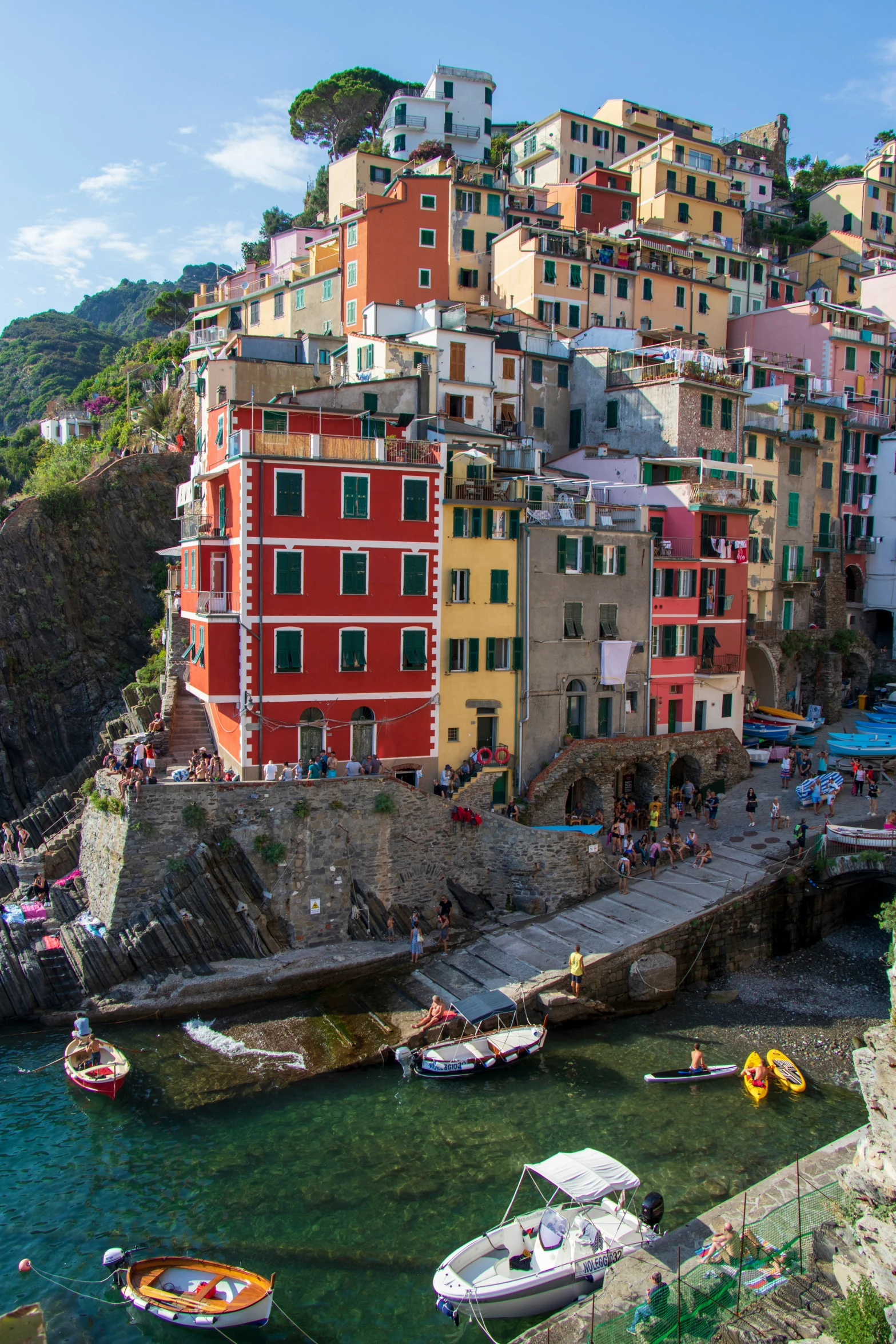 an image of people floating in the water next to many boats