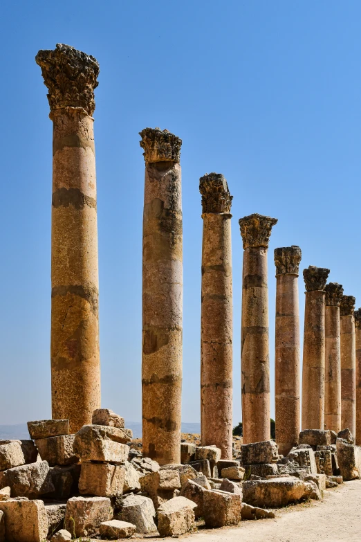 several very old columns in a desert area