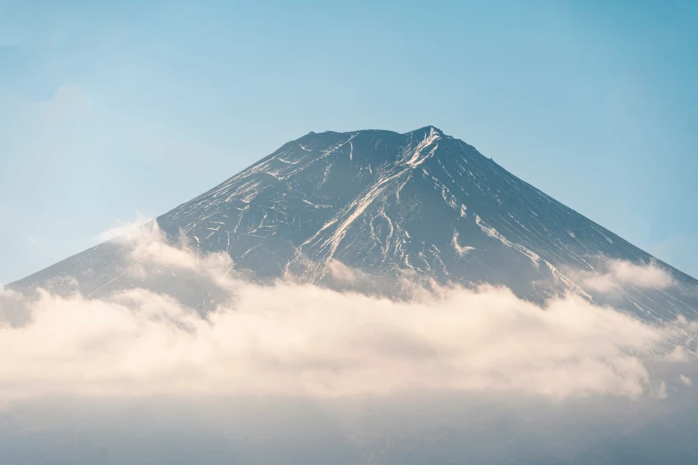 the top of a mountain towering in the sky