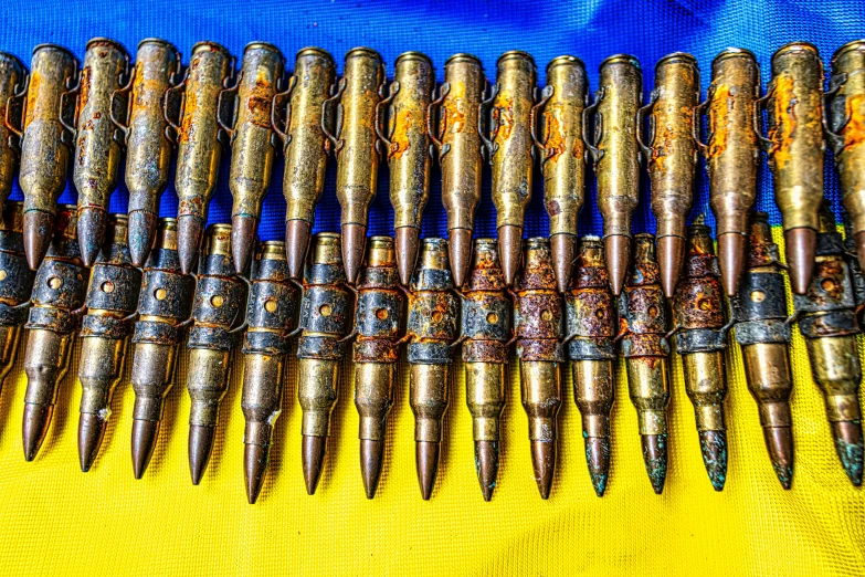 some silver colored things sitting on a yellow cloth