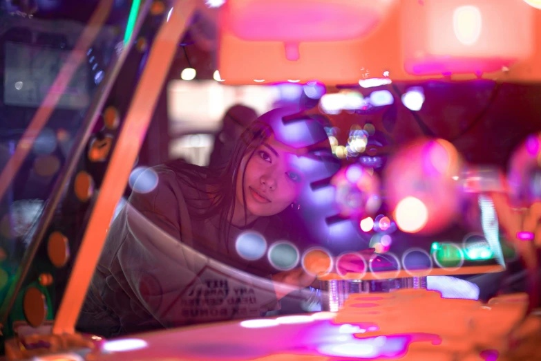 a woman taking her self portrait in a car mirror