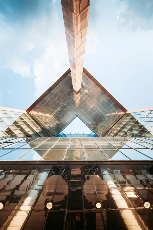 the top portion of a building in front of a blue sky