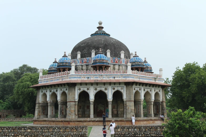 people standing in front of a large ornate building