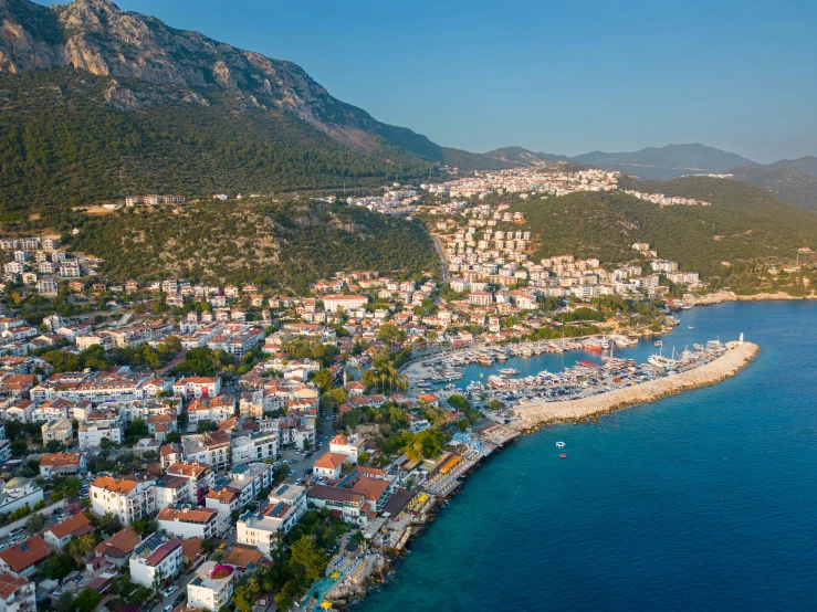 the island is surrounded by hills and houses