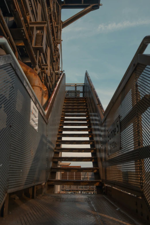 a metal staircase going up to the sky