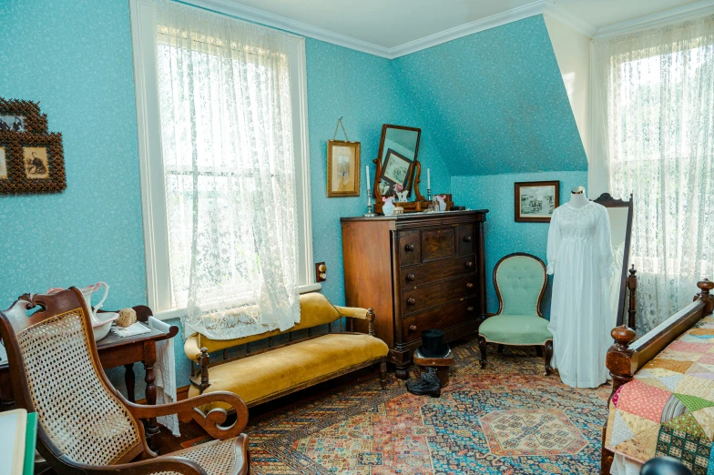 room with a colorful area rug, and lots of wood furniture and decor