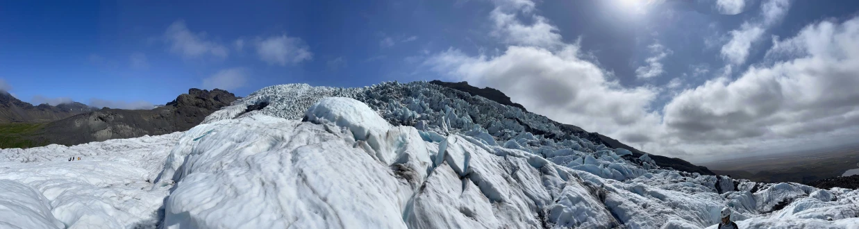 high altitude ice climbing with blue sky above