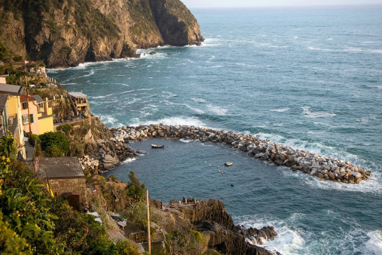 view of a beach and ocean from a hillside