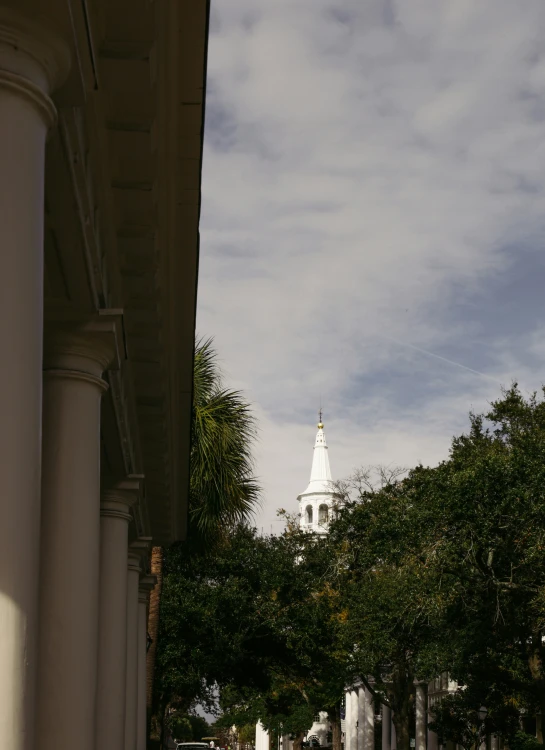 a clock tower is visible against the blue sky