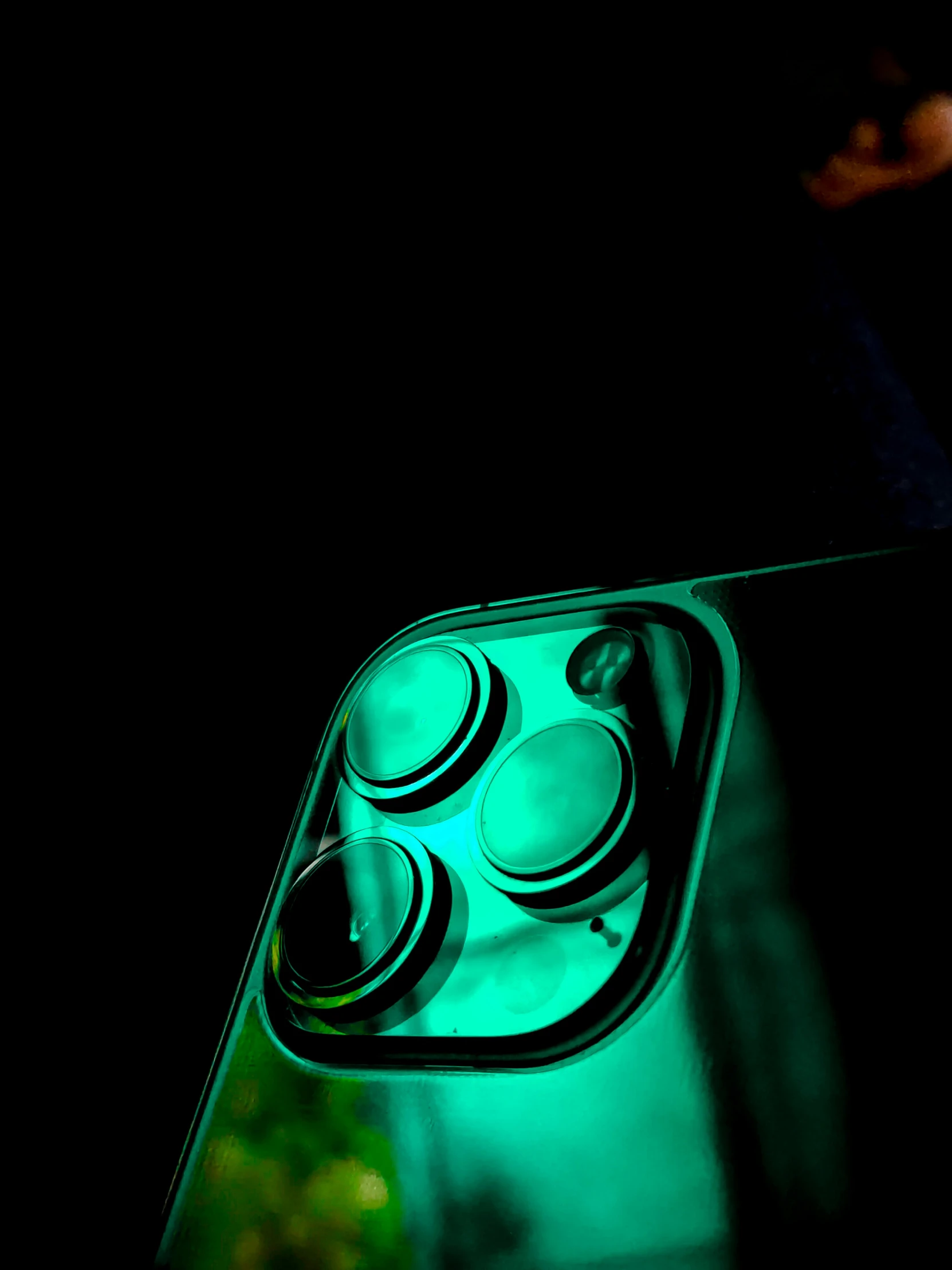 an up close picture of a green light on a car