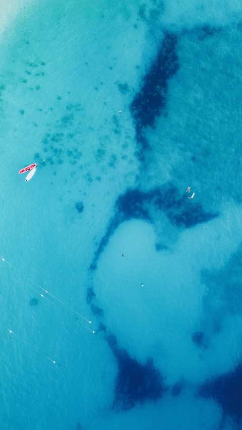 a body of water near shore with boats in it