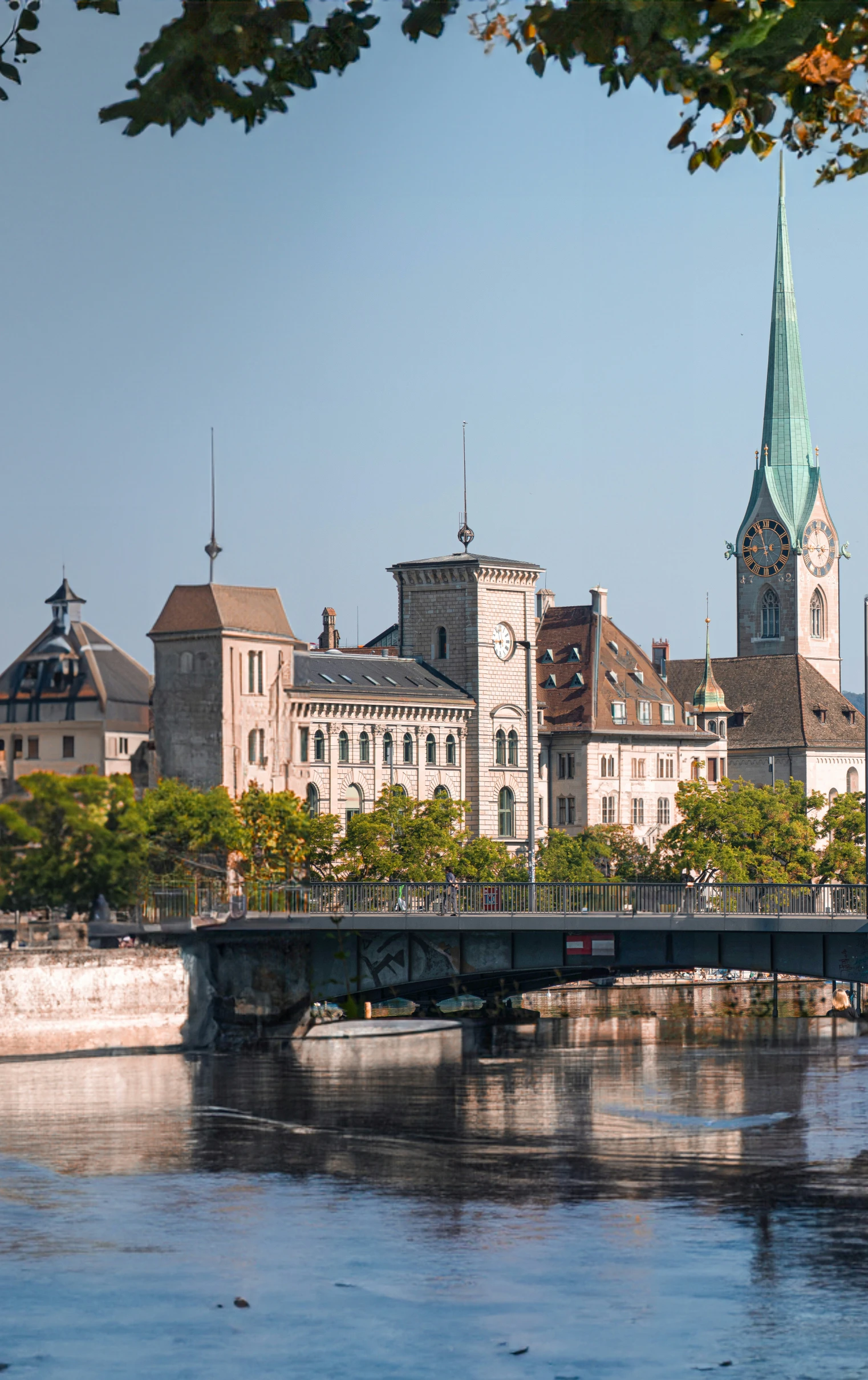 a bridge and buildings with a steeple on top