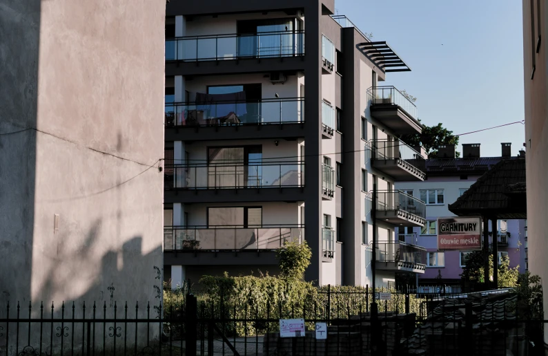 the building at the corner of the street has balconies