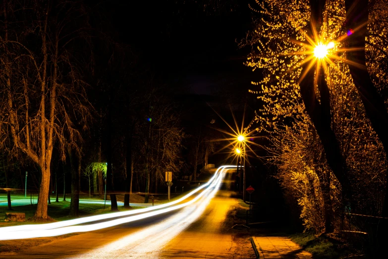 street at night, with lights from several cars