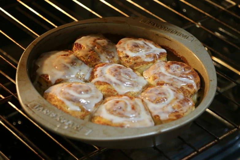 a pan filled with lots of food sitting on top of an oven