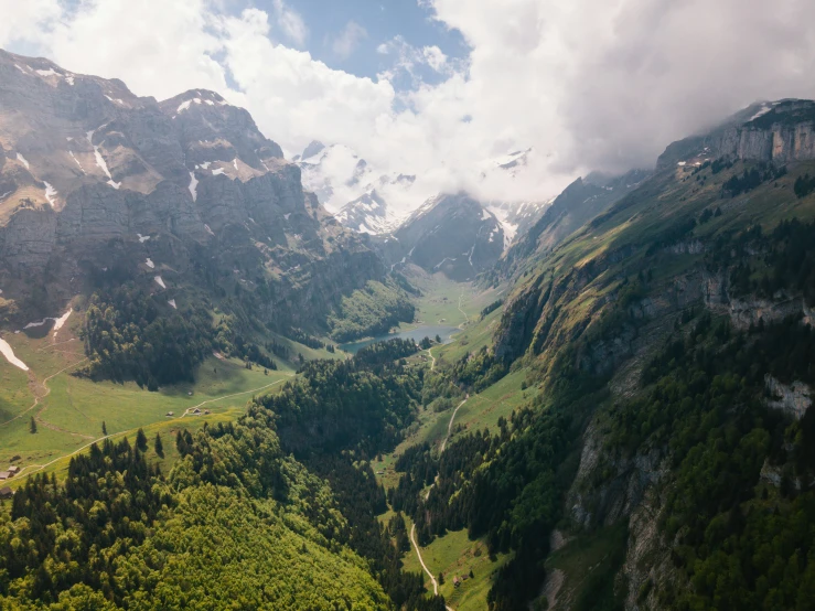 a valley that is very wide with mountains and trees on it