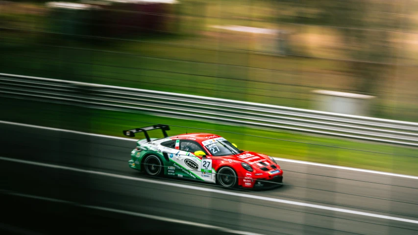 a red and green car on a race track