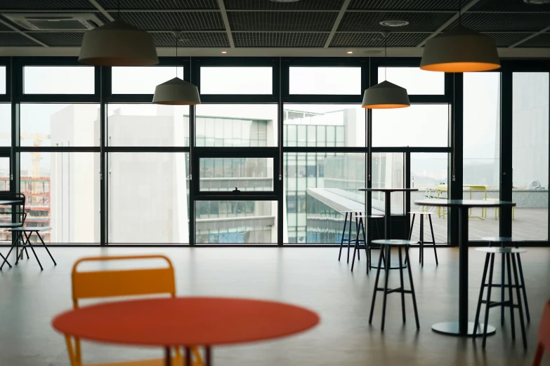 the large meeting room is set up with various tables