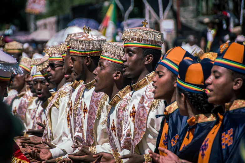 people wearing colorful hats stand together