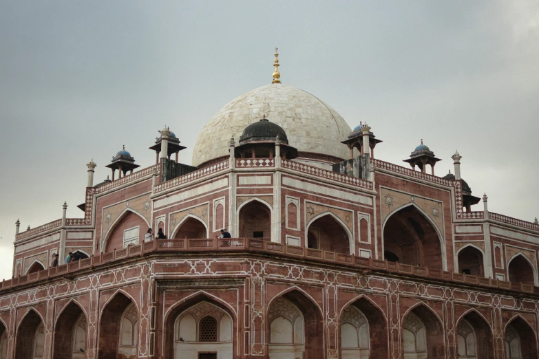 a large red and white building with a dome