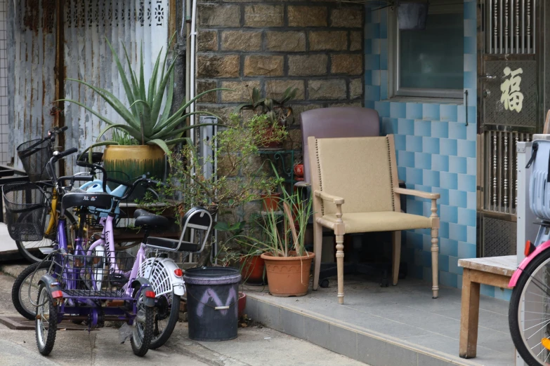 several bikes are parked on the side walk