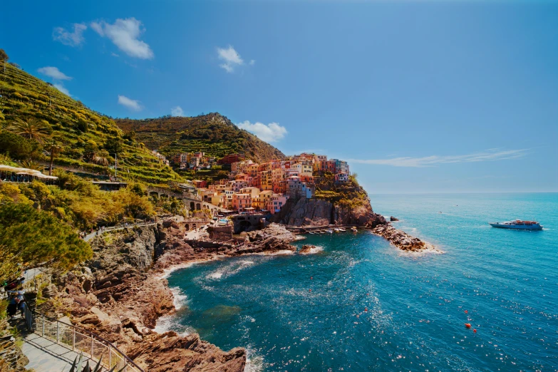 a beautiful blue ocean surrounded by lots of vegetation