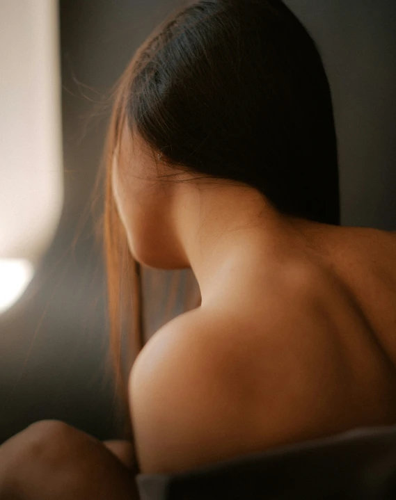 a woman with very large  and long brown hair