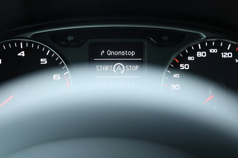 a picture of an interior dashboard with speed and fuel