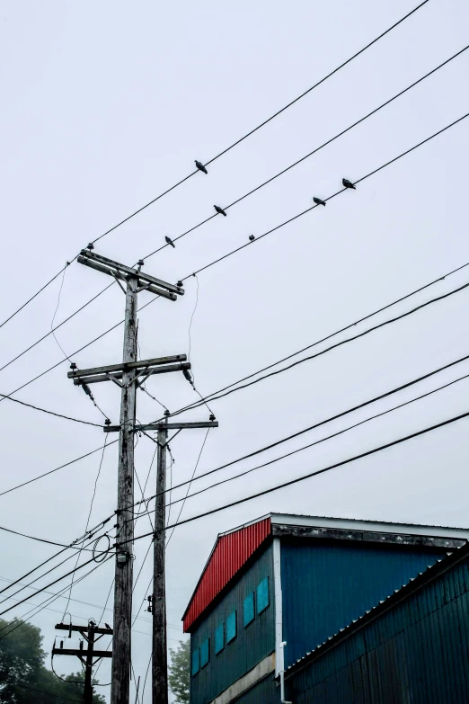 many power lines run above the top of buildings