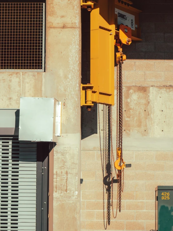 overhead view of chain link and crane in urban setting