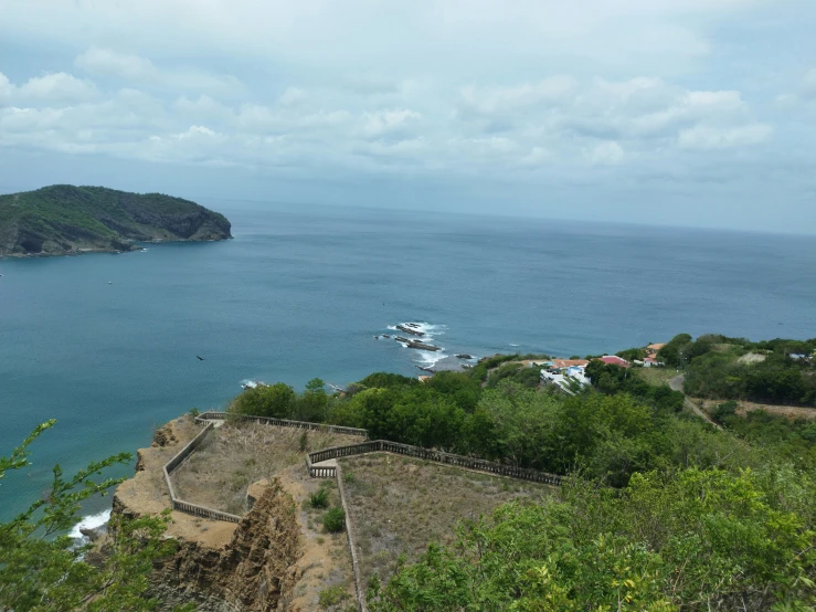 boats are in the water near some hills