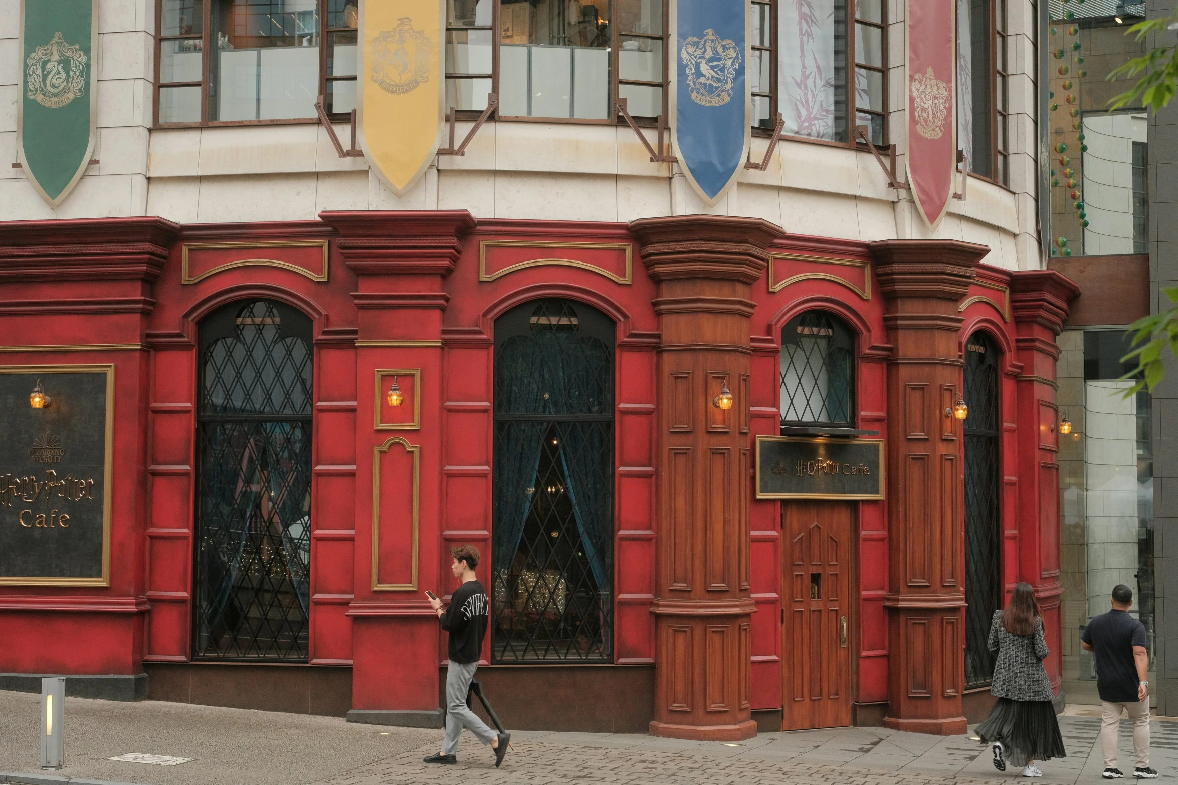 a woman walking down the street near a store