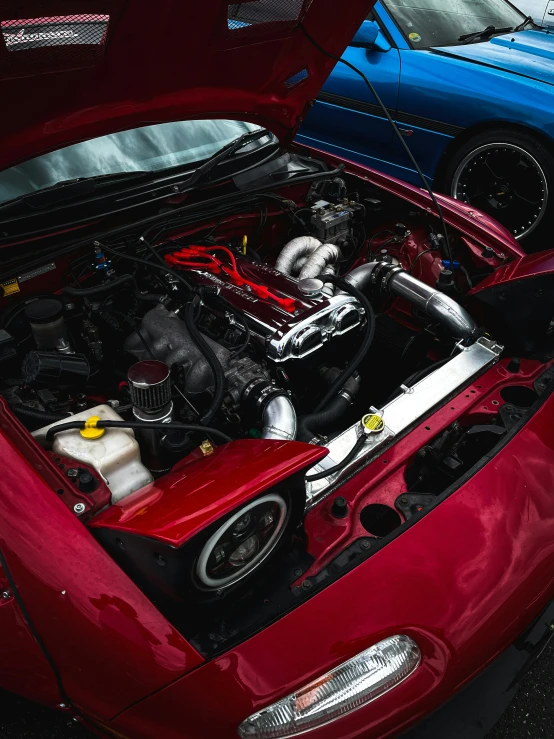 the engine compartment of a car that is open