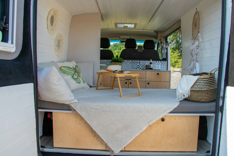 inside an rv with a large bed in the back