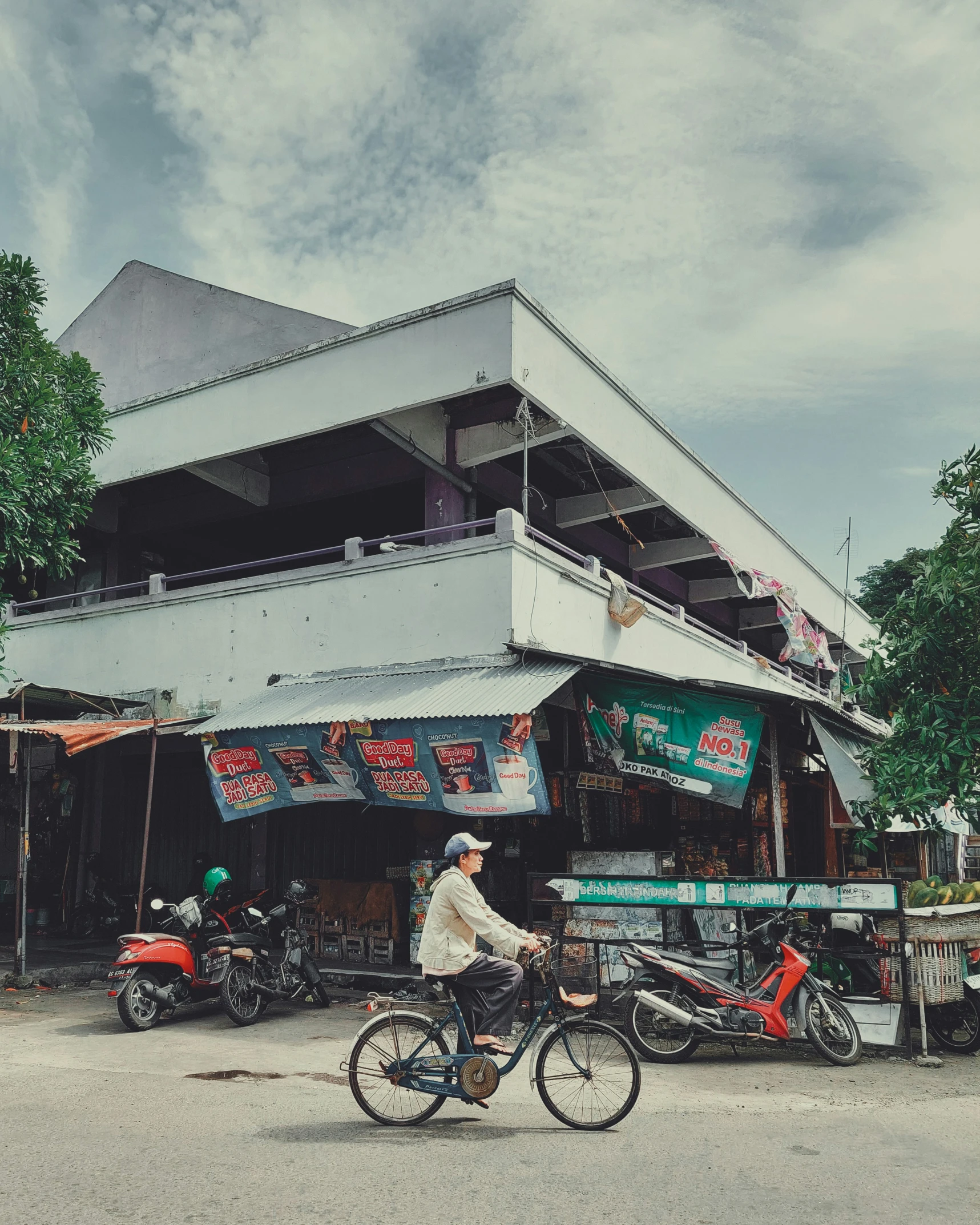 a person is riding a bike outside a building