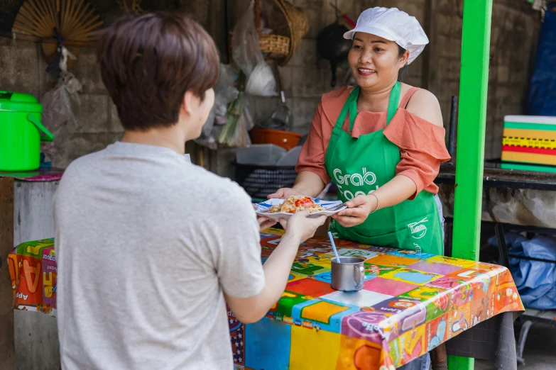 an image of woman giving her a food order