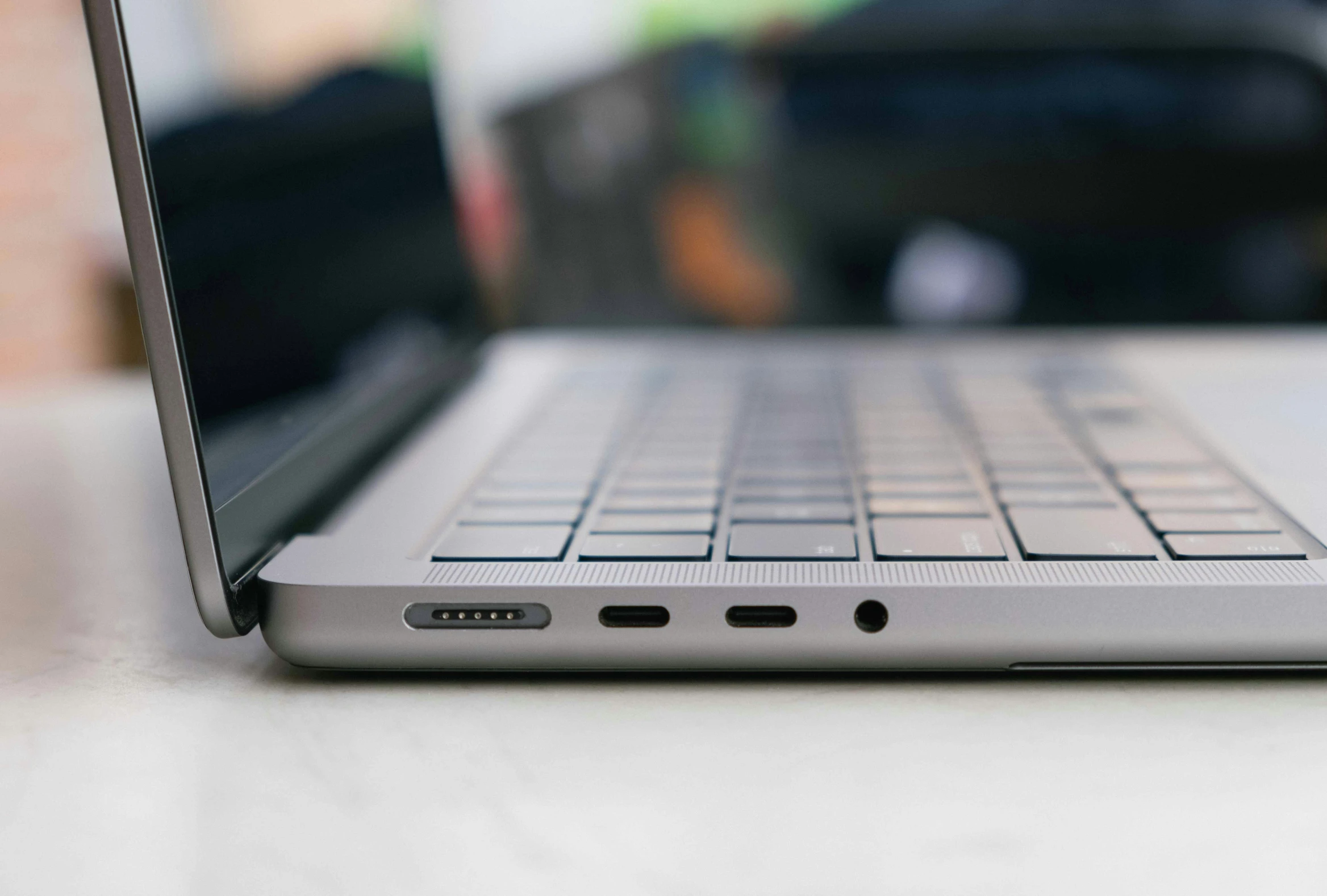 a laptop on a table in a blurry po