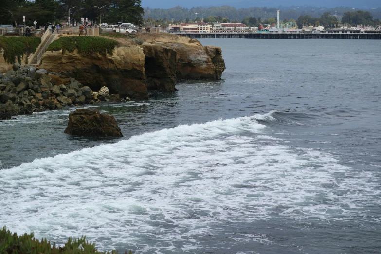 a large body of water with lots of waves coming in