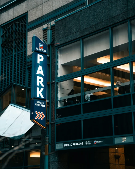 a large sign that says park with a window on the side