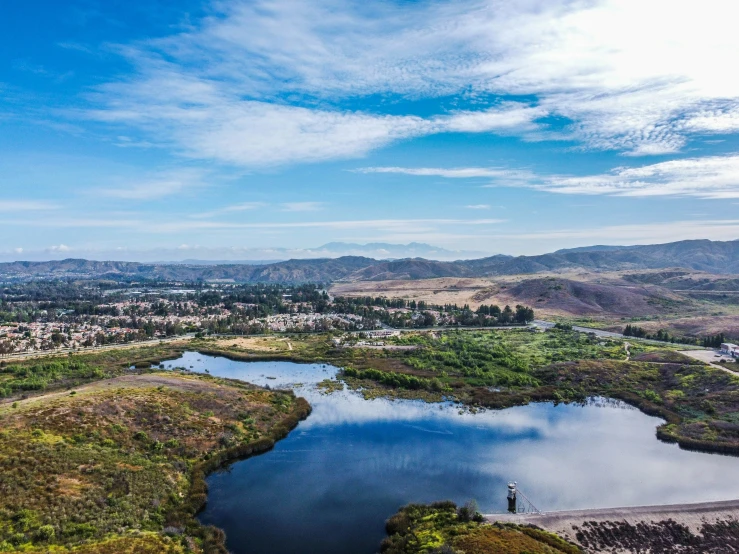 an aerial view of water in the middle of a plain