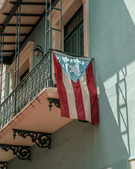 the american flag is hung outside of the building