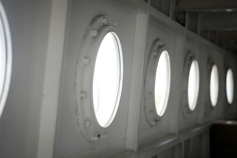 some oval windows on the side of a ship