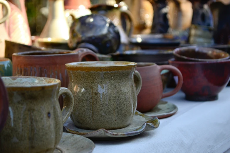 a group of coffee cups sit on a table